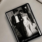 Elegant black-and-white save the date website displayed on a tablet with romantic wedding photography and editorial styling.