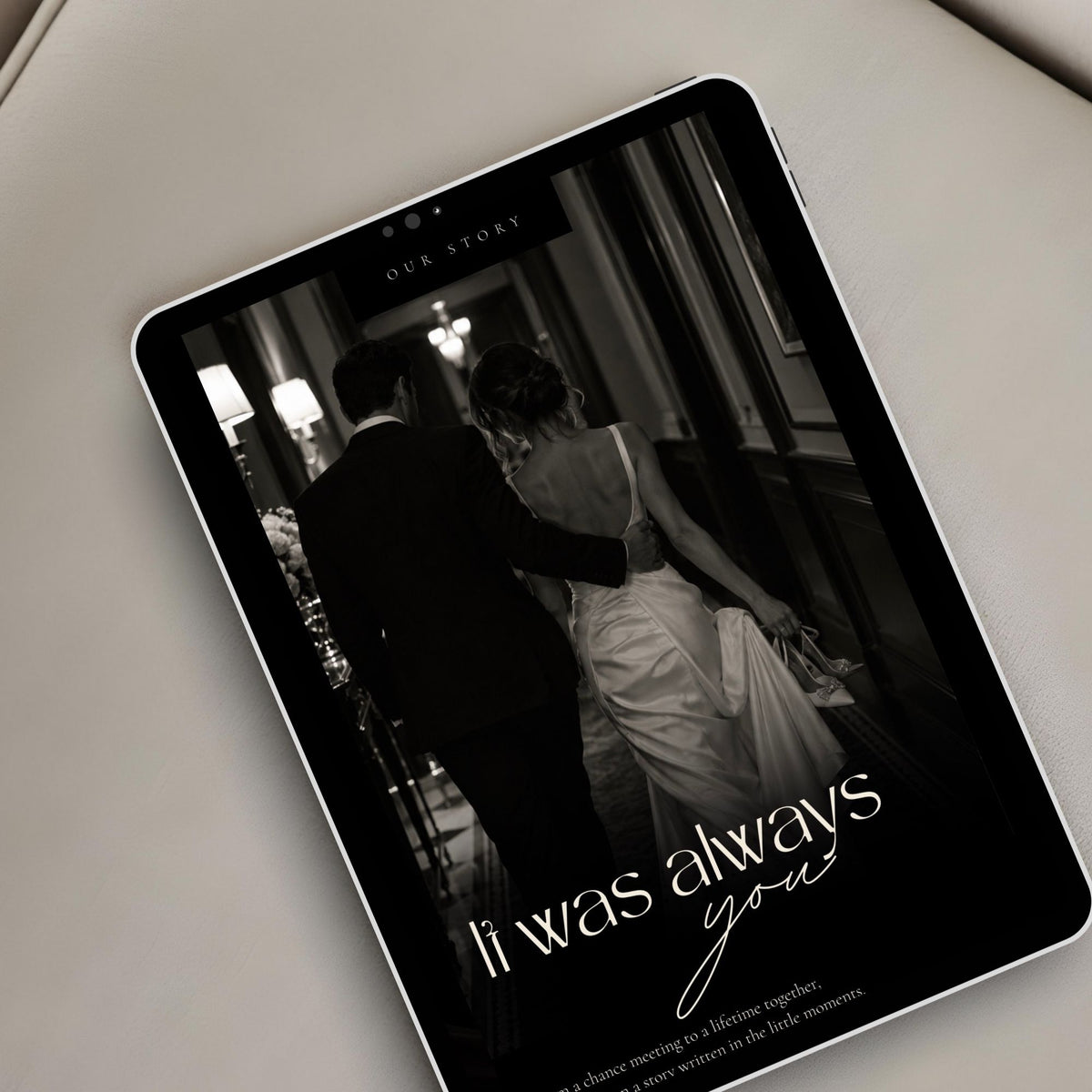 Black tie wedding website displayed on a tablet with elegant black and white couple photography and editorial styling.
