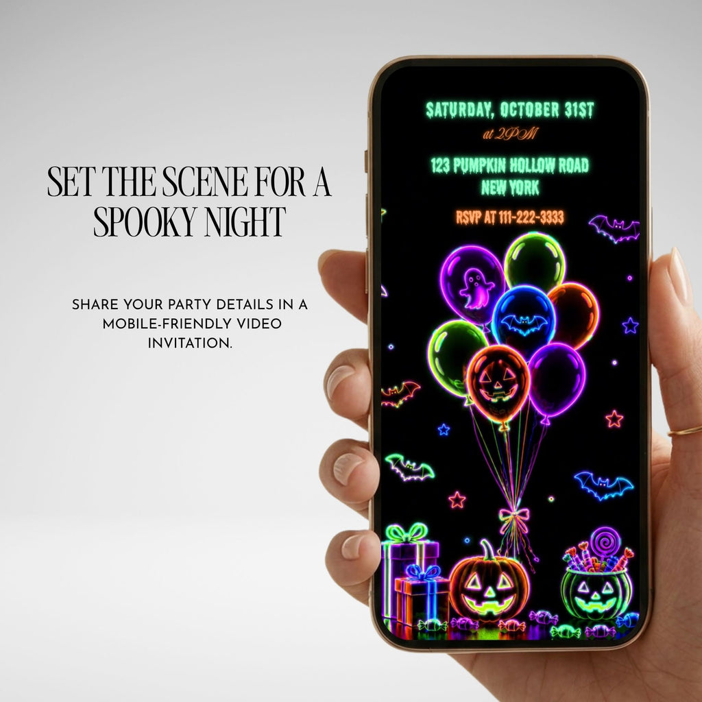 Neon Halloween birthday video invitation displayed on a mobile phone with glowing skeleton balloons, pumpkins and customisable party details.
