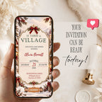 Mobile preview of an It Takes a Village baby shower invitation featuring a snowy Christmas village and festive event details.