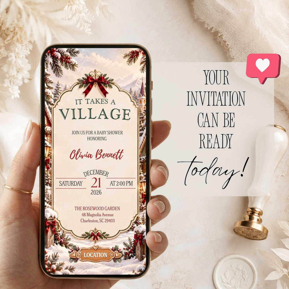 Mobile preview of an It Takes a Village baby shower invitation featuring a snowy Christmas village and festive event details.