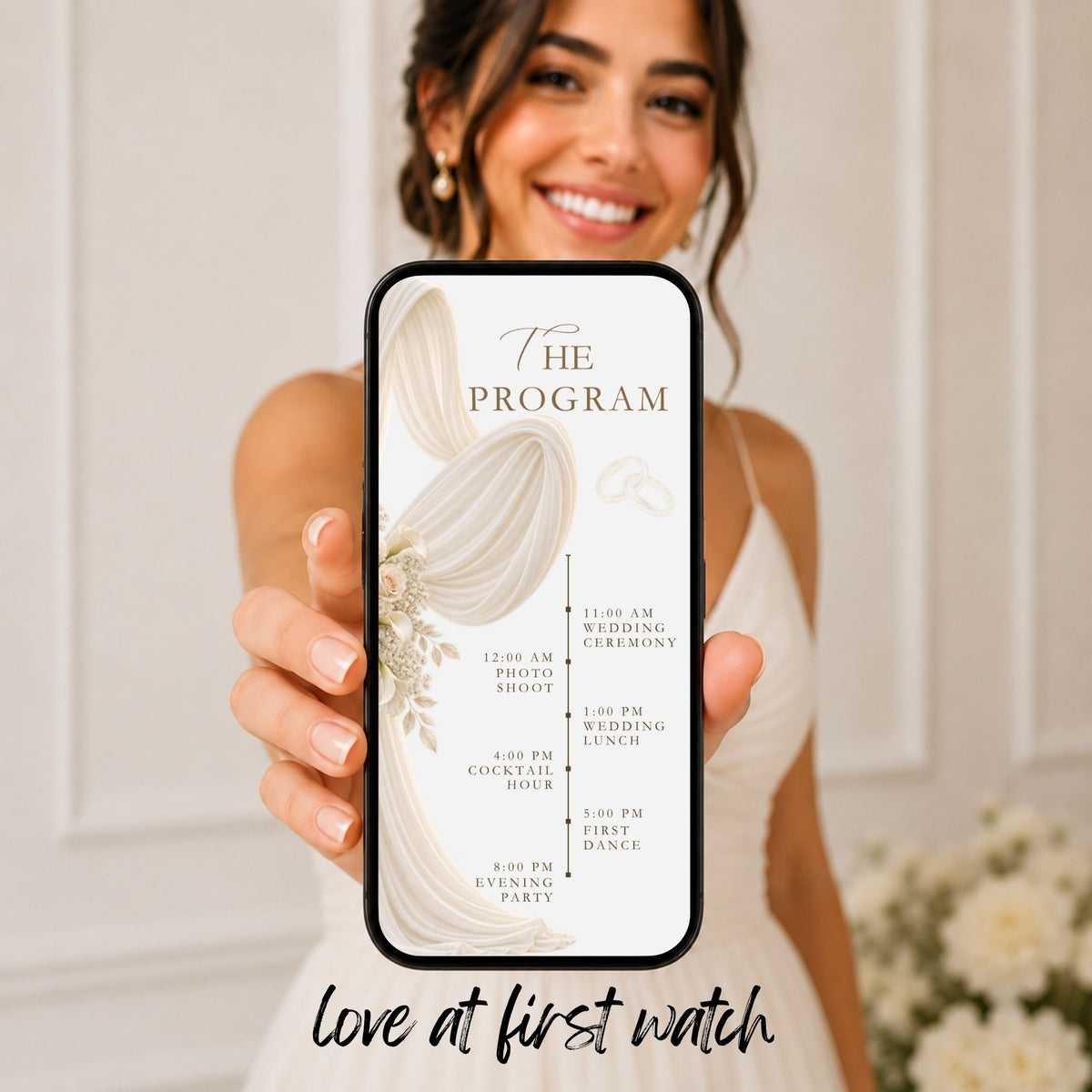 Ivory wedding video invitation programme displayed on a phone with elegant draped fabric and delicate botanical details.