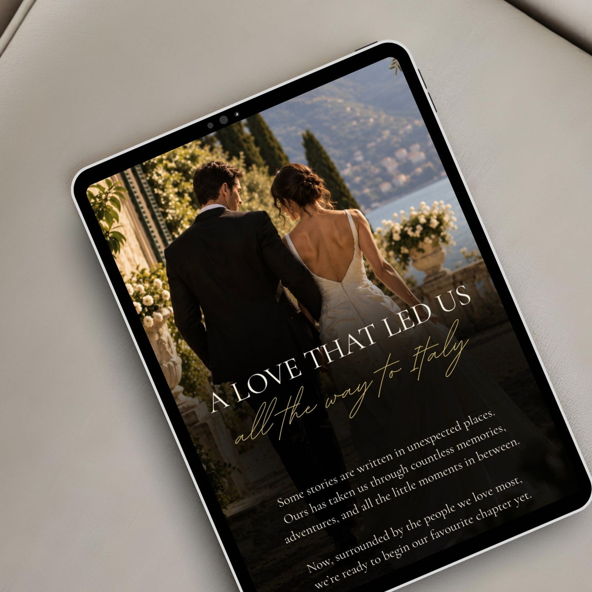 Mediterranean wedding digital invitation displayed on a tablet with romantic couple photography and Italian-inspired styling.